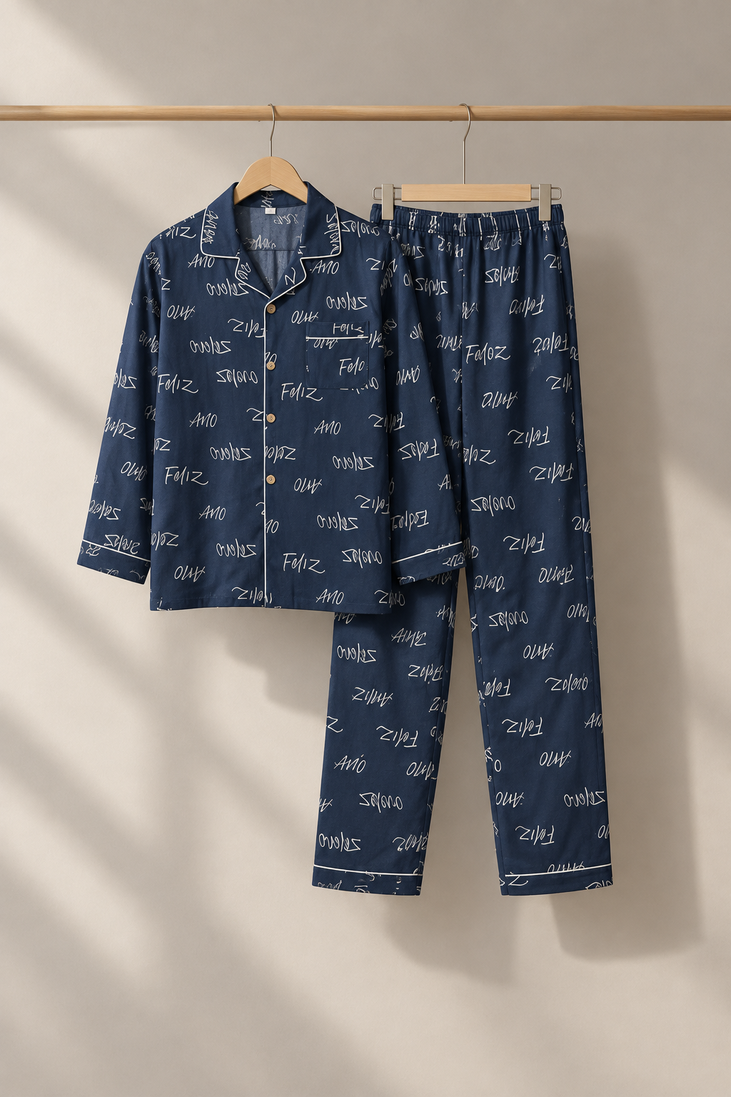 Navy script pajama set on hangers