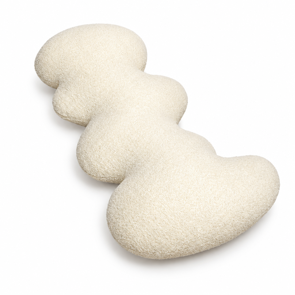 White wave accent pillow with curved silhouette on white