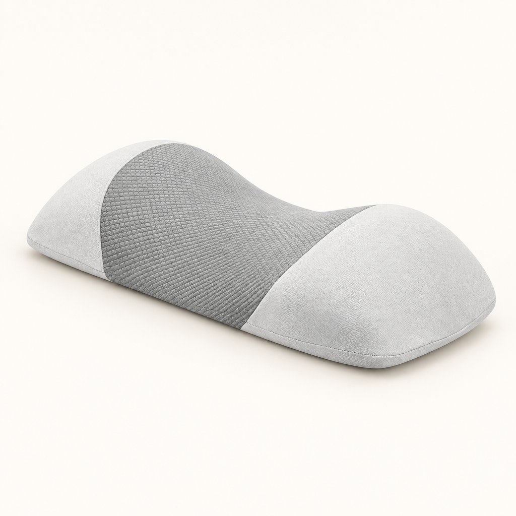 Light gray contoured memory foam waist pillow on a warm white background