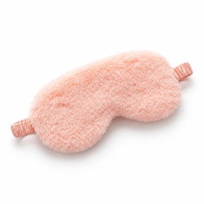 Single coral orange plush sleep eye mask on white